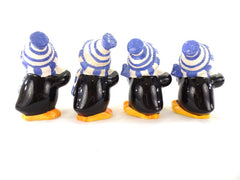Dekofiguren Set 4 Pinguine Keramik Ton 12 cm Schal Mütze Schneball